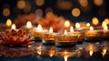 Several candles and a flower at the diwali party