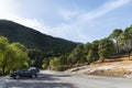 Several cars parked in a rural countryside