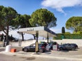 Of several cars refueling at a gas station