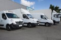 vans and trucks parked in parking lot for sale