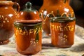 Several ceramics jars for containing saffron and pepper (words written in spanish)