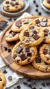 Several chocolate chip cookies arranged neatly on a wooden platter Royalty Free Stock Photo