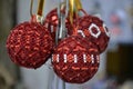 Several Christmas balls of red and white beads