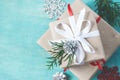 Several Christmas boxes of gifts festively decorated On a turquoise background, selective focus Royalty Free Stock Photo