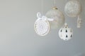 Several Christmas ornaments hanging on a white background Royalty Free Stock Photo