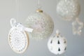 Several Christmas ornaments hanging on a white background Royalty Free Stock Photo