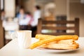 Several churros on small plate and milk with chocolate Royalty Free Stock Photo