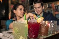 Several cocktails on the bar counter