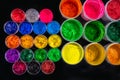 several color plastisol ink cans in tee shirt factory