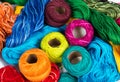 Several color spools of thread