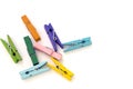 Several colored linen clothespins on white