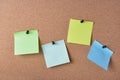 several colored note sheets pinned to cork board Royalty Free Stock Photo