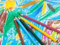 Several colored pencils on children draw picture