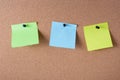 colored stickers for notes pinned to the cork board Royalty Free Stock Photo