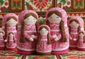 A group of traditional russian nesting dolls with pink floral patterns isolated on white background Royalty Free Stock Photo