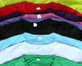 Several colorful t-shirts