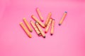 Several colorful wooden crayons isolated on pink background with copy space Colored drawing pencils for kids Royalty Free Stock Photo