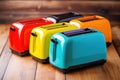 several colourful toasters aligned on wooden surface