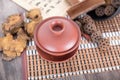 Several common Chinese herbal medicines and a purple sand tea bowl type medicine bowl