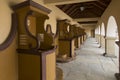 Several confessionals standing against the wall in the sanctuary