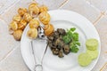 Cooked Burgundy snails in white plate Royalty Free Stock Photo