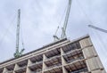 Several cranes on constructions sites at high buildings all over London UK Royalty Free Stock Photo