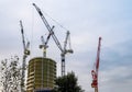 Several cranes on constructions sites at high buildings all over London UK Royalty Free Stock Photo