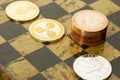 Several cryptocurrencies, bitcoin, ethereum, litecoin, ripple on chessboard