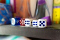 Several dice on the shelf