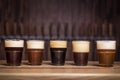 Several different beers are standing in a row Royalty Free Stock Photo