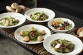 Several different fresh salad dishes on restaurant table Royalty Free Stock Photo