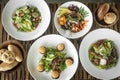 Several different fresh salad dishes on restaurant table Royalty Free Stock Photo
