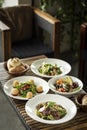 Several different fresh salad dishes on restaurant table Royalty Free Stock Photo