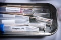 Several DNA samples from suspects in crime lab Royalty Free Stock Photo