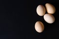 Several eggs on a black background