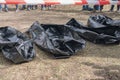 Several empty corpse body bag lie on the ground (crime concept)