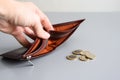 Several euro coins and an empty wallet in a man`s hand. European unemployment concept. Royalty Free Stock Photo