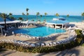 Several families enjoying their holidays time in the swimming pool of a luxury hotel resort placed close to a caribbean beach