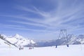 downhill skiing on prepared ski slope in Swiss Alps