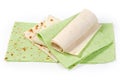 Several folded, twisted thin ordinary lavash and lavash with spinach
