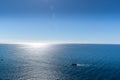 Several food processing boats moored in the distance at sea during the night illuminated by the lights glowing on the horizon Royalty Free Stock Photo