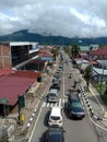 several four-wheeled vehicles stuck in traffic, seen from the flyover, Padang Panjang City, West Sumatra.