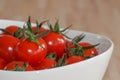 Fresh red tomatos in a white bowl Royalty Free Stock Photo