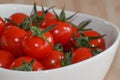 Fresh red tomatos in a white bowl Royalty Free Stock Photo