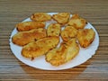 Several fried meat cutlets laid on a white porcelain plate Royalty Free Stock Photo