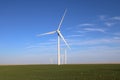 Giant wind turbines over a agriculture field