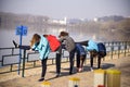 Several girls make stretching on the bank of the Desna River, Ukraine, Chernigov,