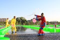 Several girls splashing water to play in the square, china