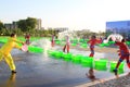 Several girls splashing water to play in the square, china