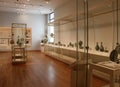 Several glass cases filled with artifacts, Museum of Fine Arts, Boston, Mass, summer, 2021